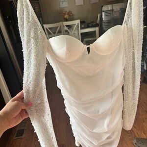 She’ll white  beaded long sleeve dress.